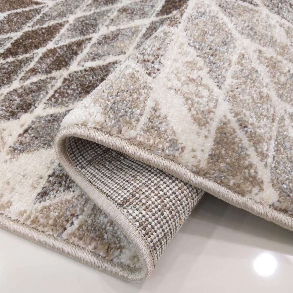 Moderní designový béžový koberec s přírodními motivy 4